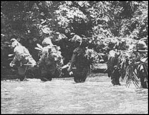 Japanese soldiers crossing water obstacle