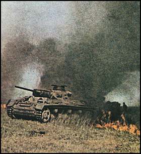 German PzKpfw III moves through burning field