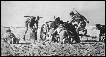 Italians soldiers position an anti tank gun