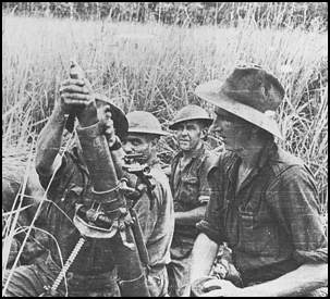 Australians mortar crew firing in New Guinea